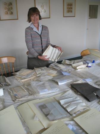 The Archivist holding receipts for carrying cider on trows from Hereford to Chepstow in 1819